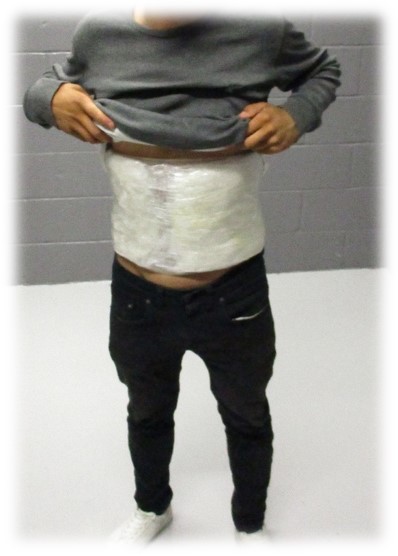 Juvenile with drugs taped to mid body
