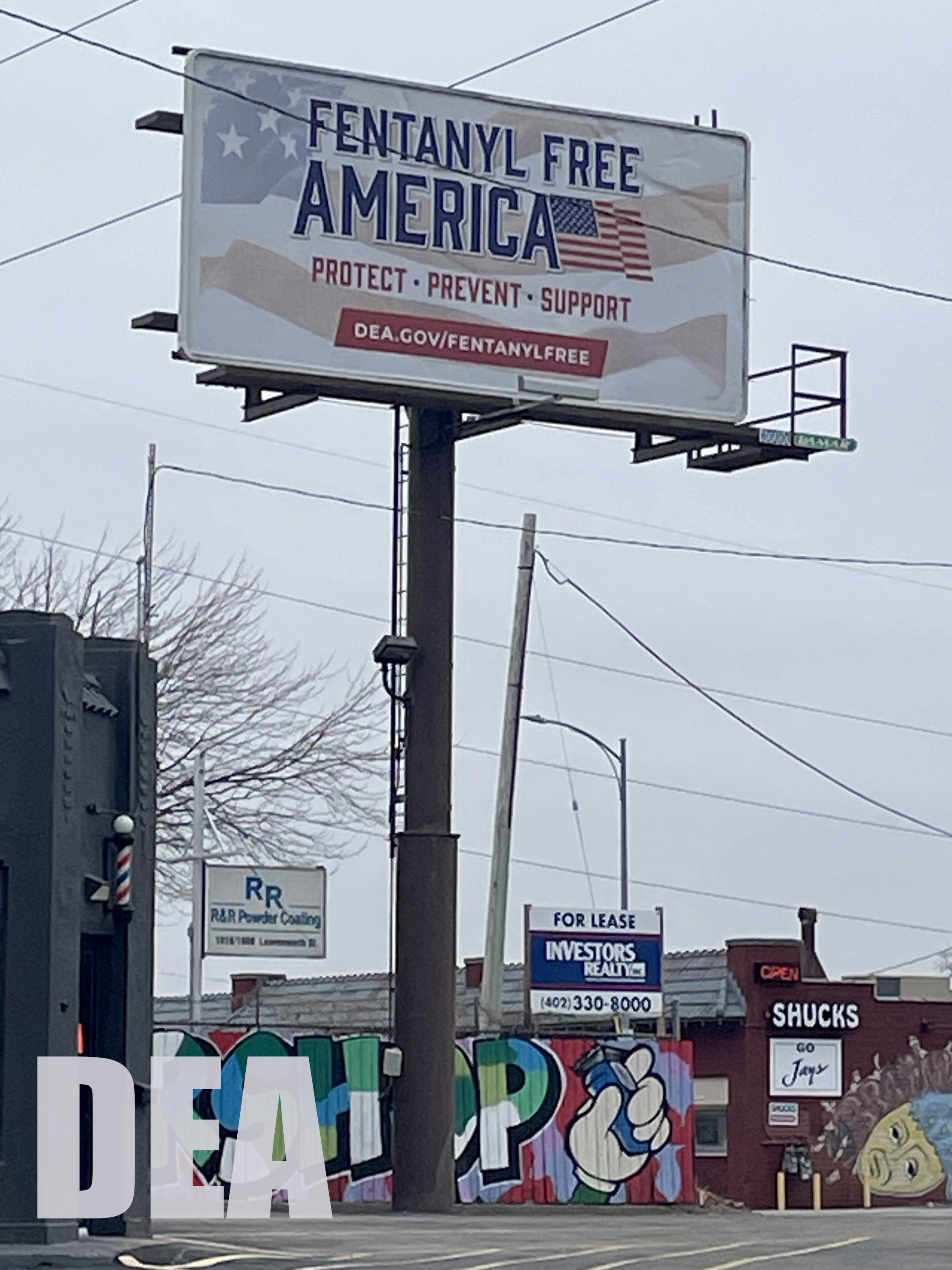 A billboard in Omaha, Nebraska with Fentanyl Free America written in blue atop of the American flag.