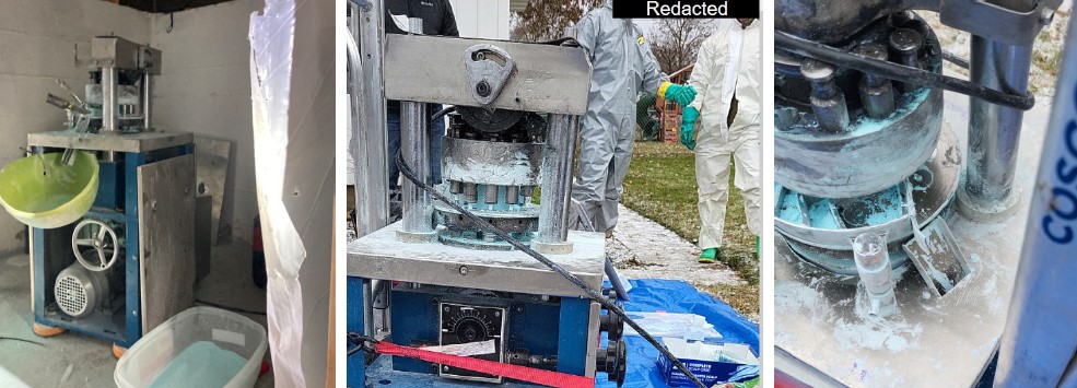 Seized pill press and fentanyl pills
