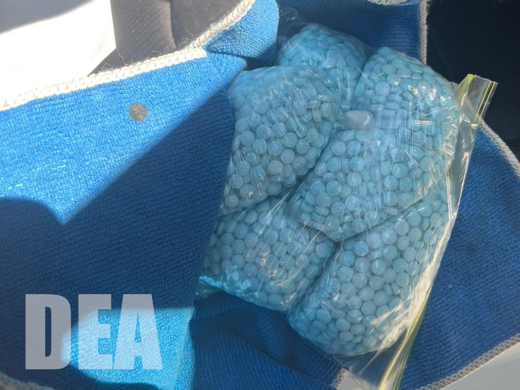 Blue fentanyl pills in a plastic bag. 