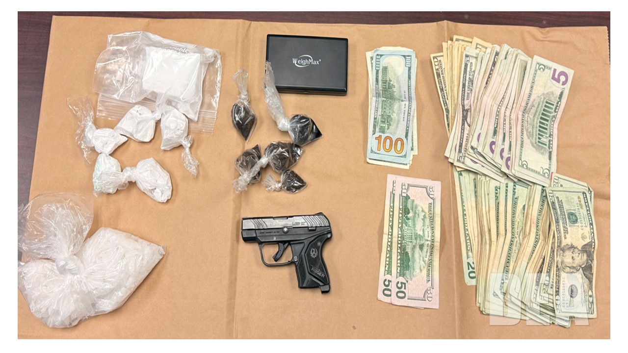 Photo of DEA, Bakersfield Police, and California Highway Patrol drug seizure. Fentanyl, methamphetamine, heroin, and firearm pictured alongside of USD.