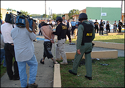 DEA Special Agent and NIE Special Agent escort individual arrested