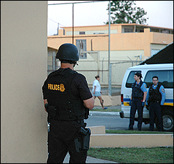 DEA Special Agents secures the perimeter.