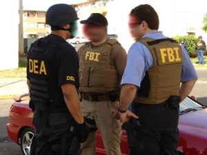 DEA and FBI Arrests VIPD Officer and Associate on RICO Charges.