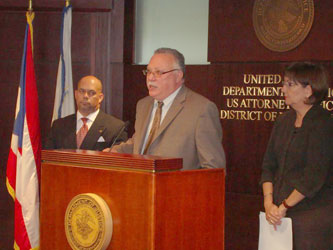 SAC Javier F. Peña takes questions from the media during the news conference. ASAC Pedro Janer (L) and US Attorney Rosa E. Rodriguez (R) look on.