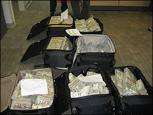 Suitcases seized by DEA agents at an apartment in Isla Verde containing $2.6 million in cash