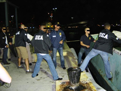 DEA, ICE and CBP agents unload the cocaine from the “Two Brothers”