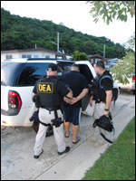 DEA and PRPD Agents take defendant into custody.