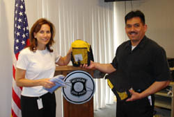 Inspector Karen Halliday and Lieutenant Tony Saucedo of the Michigan State Police with Detroit Field Division D.E.C. Kits.