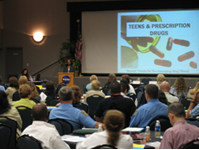 Diversion Program Manager Judett Black speaks to the audience On the National Epidemic of Prescription Drug Abuse. 