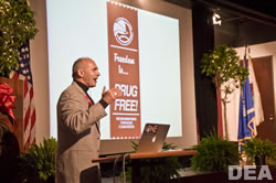 Dr. Stephen Sroka, keynote speaker at the DEA Red Ribbon Rally energizes the audience with his energy talk about the "Power of One."