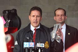 SAC Mark R. Trouville (left) talks to the press about the operation as U.S. Attorney Acosta looks on.