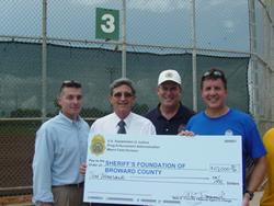 SAC Mark R. Trouville making check presentation to Sheriff's Foundation of Broward County