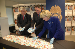 Photo displays meds turned in under the OMC program on 11-14-2009. L to R: Gerard P. McAleer, Special Agent in Charge of the Drug Enforcement Administration, New Jersey- announcing the Operation Medicine Cabinet, Angelo Valente, Executive Director, Partnership for Drug Free New Jersey, and Mary Pat Angelini, Assemblywomen, 11 District, New Jersey Assembly 
