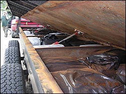 A hidden compartment which held 1200 lbs of marijuana and cocaine (right).