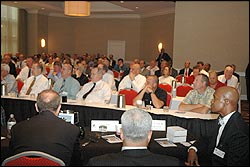 SAC Fox, front row - far right, looks on as Director Riley gives his presentation.