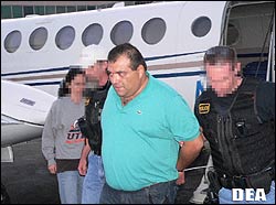 Jorge Mario Paredes-Cordova is escorted by DEA agents upon his arrival in the United States.