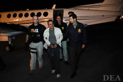 DEA Agents and U.S. Marshals Escort FARC Commander From Plane