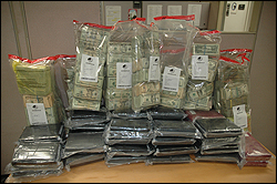 Photo of evidence seized at the conclusion of this investigation - $1,000,000 USC and 81 Pounds of Cocaine