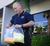 SA Joe Kilmer seizing drugs from RX NETWORK