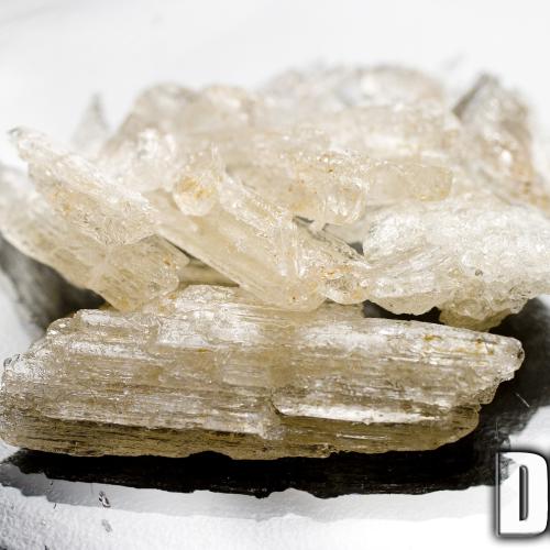 White crystalline substance with DEA in lower right corner in white