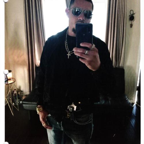 Selfie photo of Jimenez with a revolver