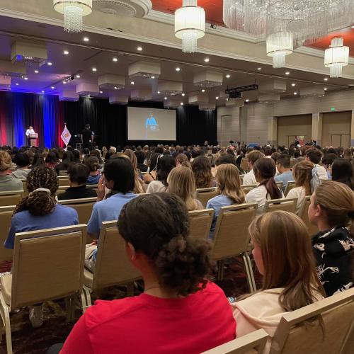 Audience of students listening to speaker Micha Allegood.