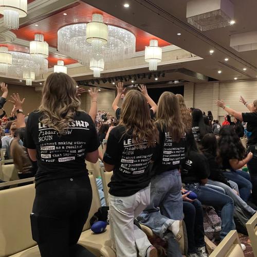 Students jump up for prizes.