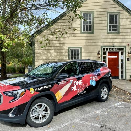 DEA New England car with One Pill Can Kill wrap
