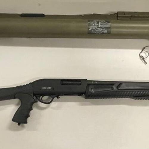 The rocket-propelled grenade launcher and one of the assault weapons seized by the investigation