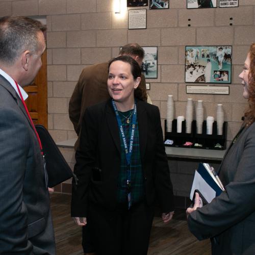 three people talking to each other