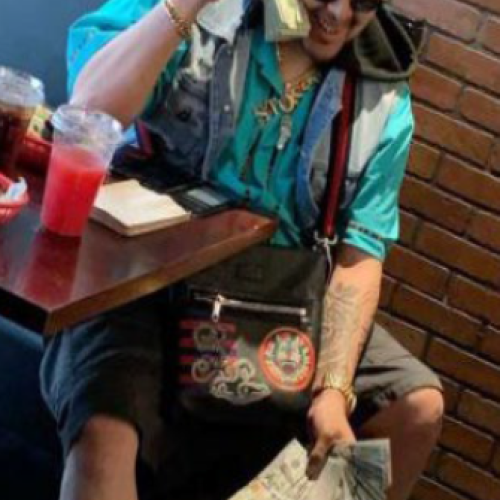 Valencia Rosas with cash.