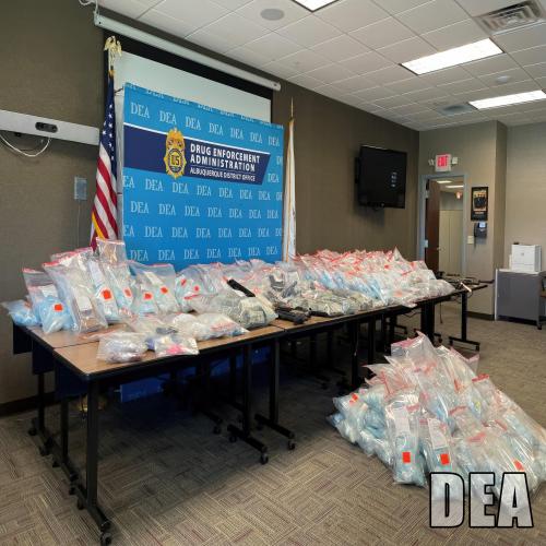 Drugs displayed on a table in a conference room
