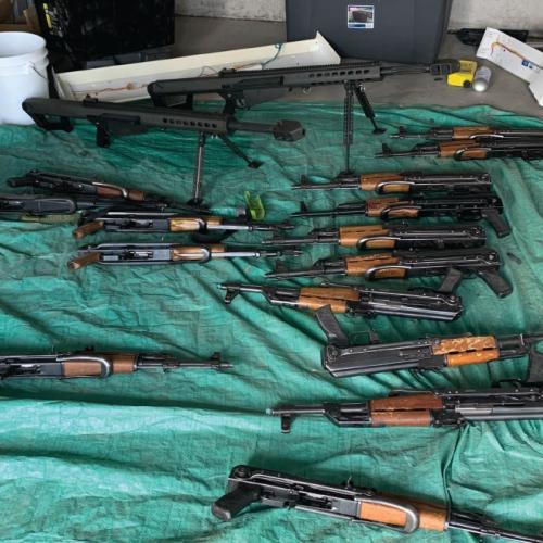 Photo of 20 AK-47 type firearms and two .50 caliber rifles seized on August 21, 2023, in the Western District of Texas.
