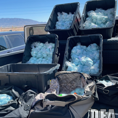 Fentanyl pills in storage containers in the back of a truck