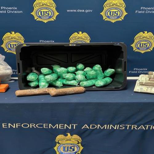 drugs and cash displayed on a table