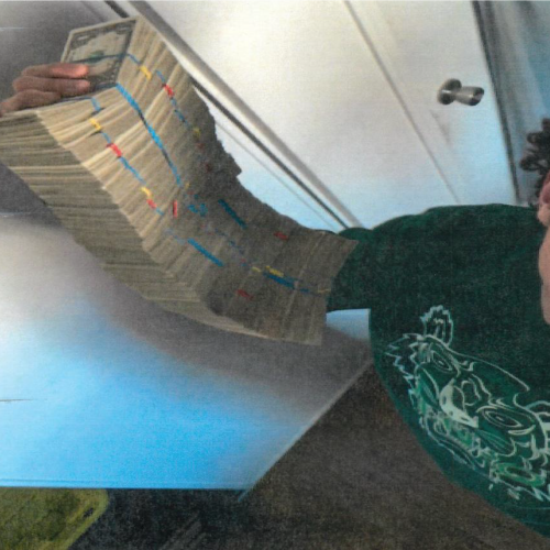 Photo of defendant's phone, showing bundles of cash.