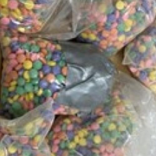 Seized fentanyl pills in various colors.