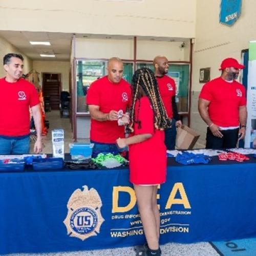 SAC Mian (left) and DEA Team shared drug prevention resources.