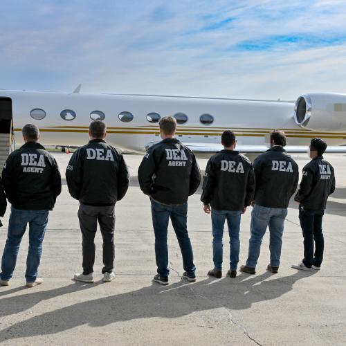 DEA agents standing in front of a plane before boarding with Sebastian Marset