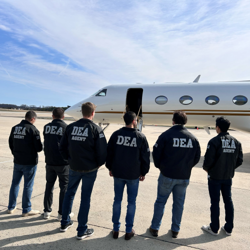 DEA agents standing in front of a plane before boarding with Sebastian Marset