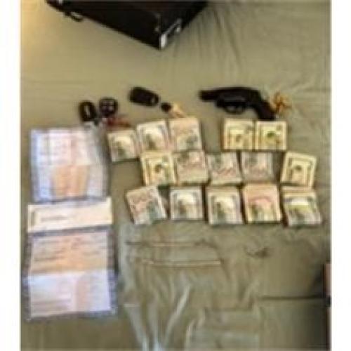 Cash and weapons recovered during the investigation