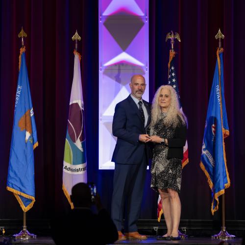 Laura Lynch (Bellevue, WA) awarded Excellence in Prevention Award by DEA Administrator Terrance Cole.