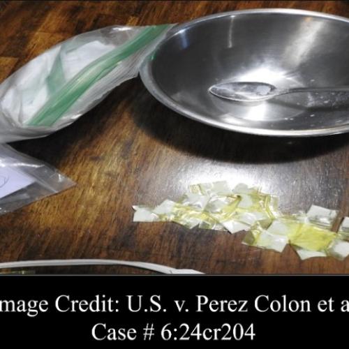 Seized fentanyl in a bag atop a table.