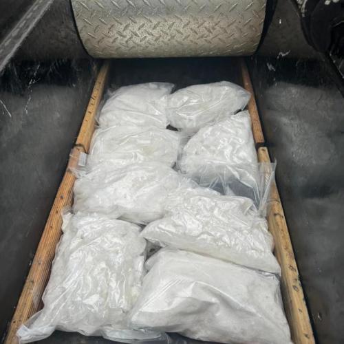Numerous clear bags containing a white substance.