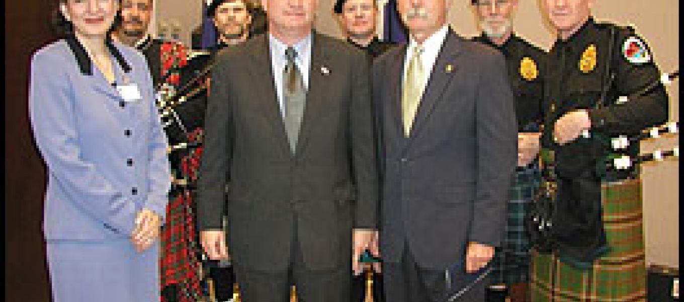 Front Row: (Left to Right) Karen Tandy, Deputy Associate Attorney General; John P. Walters, Director of White House Office on National Drug Control Police (ONDCP); William B. Simpkins, Drug Enforcement Administration, Acting Administrator.  Back Row: (Left to Right) DEA Bag Pipes Special Agents David Barnett, Thomas Ollen, Matt Gordon, Peter O'Brien and Kevin Donnelly.