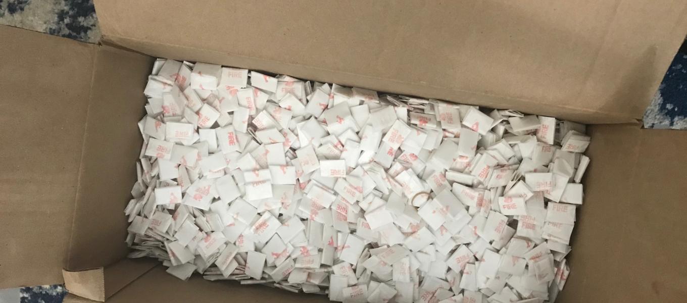 Close up of "fire" branded heroin and fentanyl glassine