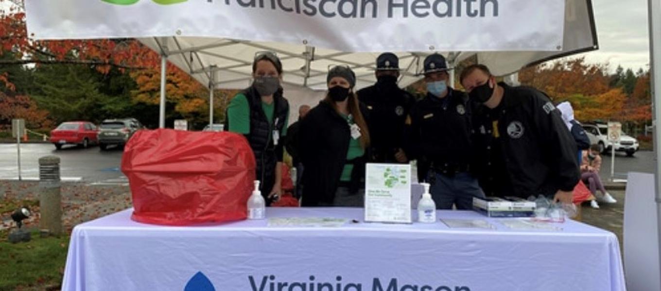 Virginia Mason staff and WSP troopers collecting prescription drugs