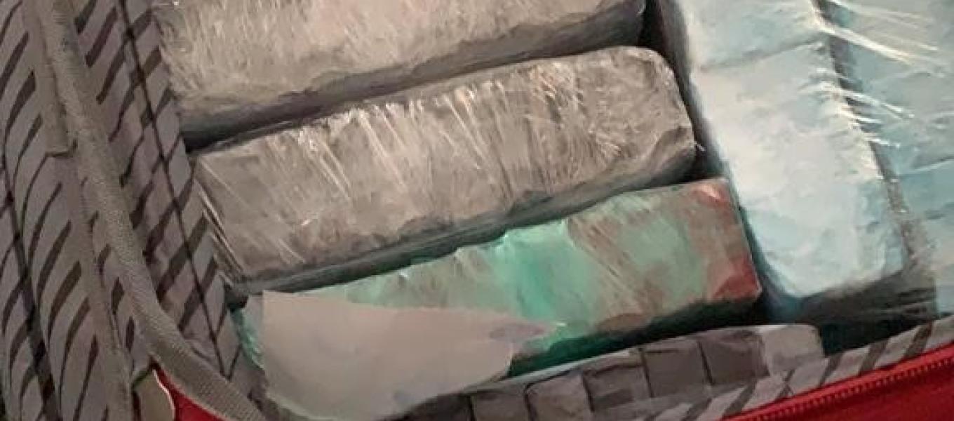 Heroin Fentanyl filled glassines seized in suitcase