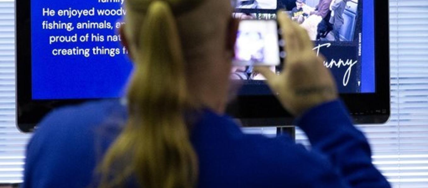 Participant watching a a tribute video with loved ones lost to the Fentanyl Poisoning Crisis.